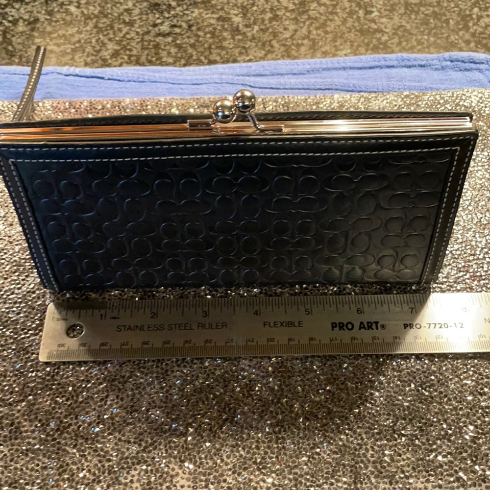 Coach wristlet black leather embossed with coach “c”